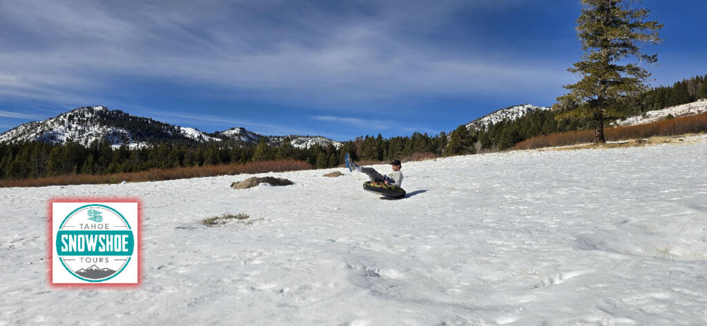 Group enjoying snow tubing on a snowy slope in Lake Tahoe.