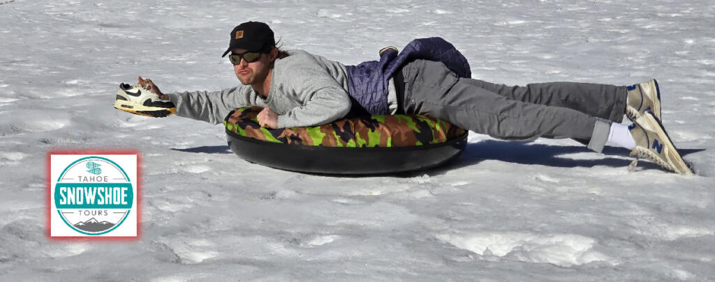 Group enjoying snow tubing on a snowy slope in Lake Tahoe.