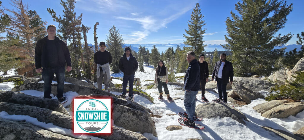 Panoramic views of Lake Tahoe with snow-covered peaks.