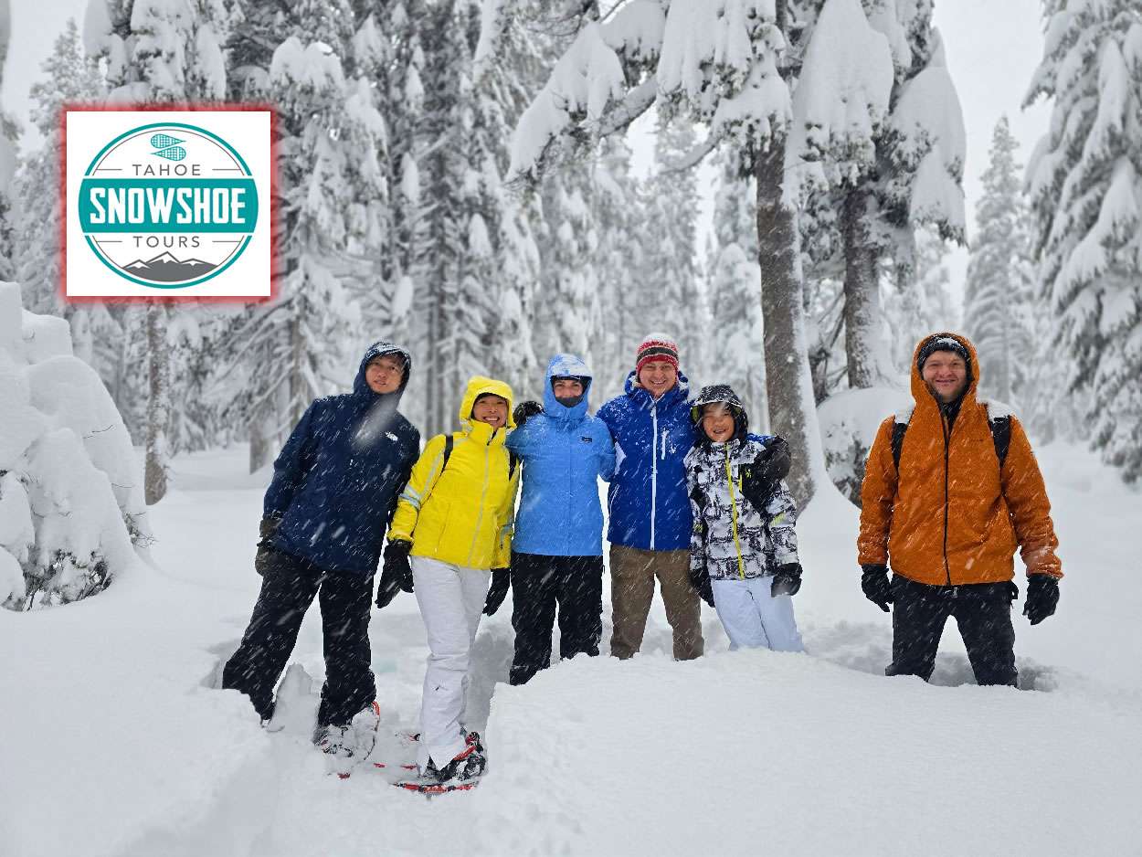 Guests snowshoeing with Tahoe Snowshoe Tours in a snowy Lake Tahoe forest